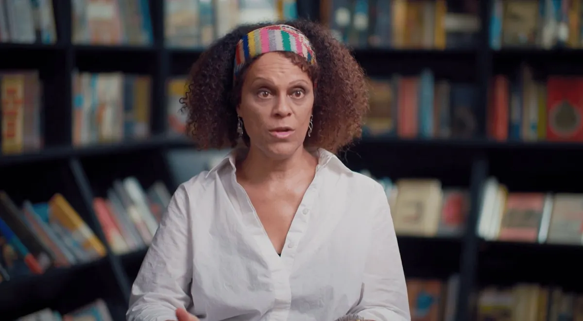 Bernardine Evaristo interviewed in front of shelves of books